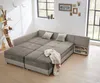 A modular sofa bed is shown in a room with large windows. Produktbild-Vorschau
