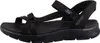 Auf dem Bild ist eine schwarze Sandale zu sehen die von der Seite betrachtet wird. Die Sandale hat ein einfaches Design mit einem ankle strap und einer flachen Sohle. Produktbild-Vorschau