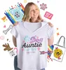 A woman is holding up a t-shirt with dog-themed graphics, surrounded by various dog-related icons and graphics. Náhled obrázku produktu