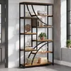 A tall, multi-shelf bookshelf filled with decorative items and books, placed in a room with a brick wall and a window. Voir les images du produit