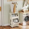 A laundry room with a washing machine and a multi-functional laundry cart. Náhled obrázku produktu