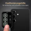 A hand is holding a lens protector template over a smartphone camera module. Produktbild-Vorschau