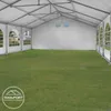 Interior view of a white party tent set up on a grassy area. Produktbild-Vorschau
