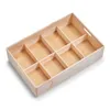 An empty wooden organizer tray with multiple compartments, shown from a slightly elevated angle against a white background. Náhled obrázku produktu