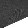 A close-up view of a black bath mat, showing its textured surface and rubber backing. Produktbild-Vorschau
