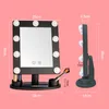 A makeup mirror with LED lights and dimensions shown, displayed with makeup brushes and applicators. Produktbild-Vorschau