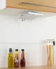 A kitchen scene with a shelf-mounted holder, bottles of oil and sauce, and a jar of spaghetti. Produktbild-Vorschau