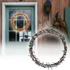 Two illuminated wreaths are displayed outdoors, one hanging on a green door and another in the foreground. Produktbild-Vorschau