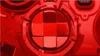 A close-up, red-toned image of a video game controller's directional pad. Podgląd zdjęcia produktu