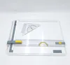 A white drafting board with drawing tools on it, set against a white background. Náhľad obrázku produktu