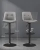 Two gray bar stools against a gray background. One stool is shown from the side with height measurements, and the other is shown from the front demonstrating its 360-degree rotation. Náhled obrázku produktu