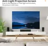 A living room with a projection screen displaying a landscape image. Náhled obrázku produktu