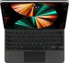 A top-down view of an open Apple Magic Keyboard for an iPad Pro, showing the keyboard and trackpad, with the iPad screen displaying a colorful wallpaper. Náhled obrázku produktu