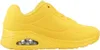 A studio shot of a single yellow SKECHERS UNO STAND ON AIR sneaker against a white background. Podgląd zdjęcia produktu