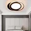 A modern ceiling light fixture above a bed in a bedroom. Náhled obrázku produktu