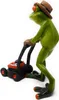 A green frog figurine wearing a straw hat and brown gloves, pushing a toy lawnmower. Produktbild-Vorschau