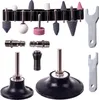 A collection of pneumatic grinding accessories, including various grinding stones, adapters, and wrenches, laid out against a white background. Produktbild-Vorschau