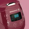 Close-up view of a maroon rice cooker's control panel. Produktbild-Vorschau