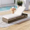 A lounge chair next to a pool on a wooden deck with a rug. Náhled obrázku produktu