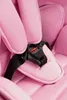 A close-up view of a pink car seat's buckle and straps. Náhled obrázku produktu