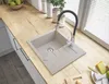 A kitchen counter with a sink, faucet, and some food items. Podgląd zdjęcia produktu