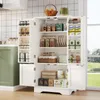 A white kitchen cabinet filled with various kitchen items and food products, placed in a well-lit kitchen environment with a window in the background showing a green landscape. Náhľad obrázku produktu