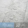 Close-up of gray textured flooring with water droplets, showing it is water resistant and has a real 3D texture Produktbild-Vorschau