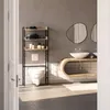 A modern bathroom with a toilet, shelving unit, and vanity with sinks. Náhled obrázku produktu
