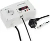 A white electronic device with a digital display and various cables and plugs, set against a white background. Produktbild-Vorschau