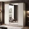 A modern bedroom with a large wardrobe featuring mirrored doors, reflecting a chair and a window view. Produktbild-Vorschau