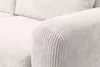 Close-up of the armrest and cushions of a beige corduroy sofa. Voir les images du produit