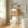 A bamboo shelving unit over a toilet in a bathroom. Produktbild-Vorschau