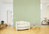 A living room with a sofa, a small table, a cabinet, and a bicycle. Produktbild-Vorschau