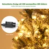 Close-up of a decorated Christmas tree with lights and a power adapter. Produktbild-Vorschau