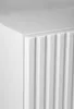 A close-up view of the corner of a white cabinet with a fluted door. Podgląd zdjęcia produktu