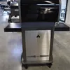 A grill is shown in a showroom or workshop setting. Podgląd zdjęcia produktu