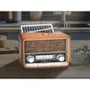 A retro-style radio with a solar panel on top, placed on a wooden table in a kitchen setting. Náhľad obrázku produktu