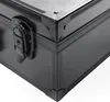 A close-up view of the corner of a black cosmetic case, showing the latch and reinforced corners. Produktbild-Vorschau
