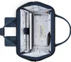 The inside of an open navy blue backpack is shown, with a laptop, notebook, and pen inside. Voir les images du produit