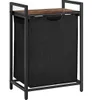 A freestanding laundry basket with a shelf, made of metal and fabric, with a wooden top. Podgląd zdjęcia produktu