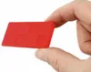 A hand holding a red wedge. Produktbild-Vorschau