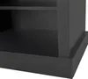 A close-up view of the bottom section of a dark-colored furniture piece, likely a storage unit or bench, showing its base and a shelf. Anteprima dell’immagine prodotto