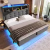 A modern bedroom with a bed featuring integrated LED lighting and storage. Produktbild-Vorschau