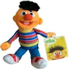 A plush toy of Ernie from Sesame Street is shown against a white background, holding a product tag. Produktbild-Vorschau
