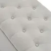 A close-up view of a tufted upholstered bench. Voir les images du produit