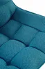 A close-up view of the tufted fabric seat of a chair. Anteprima dell’immagine prodotto