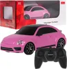 A pink Rastar Volkswagen Beetle remote-controlled car and its remote control are displayed on a white background, with the product's packaging visible in the upper left corner. Náhled obrázku produktu