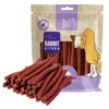 A bag of dog treats with some treats spilled in front. Náhľad obrázku produktu
