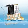 A brass solenoid valve with a black coil is shown partially submerged in water, with water splashing around it. Náhled obrázku produktu