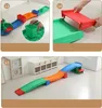 Collage of images showing assembly steps and the final assembled product of a children's slide. Voir les images du produit
